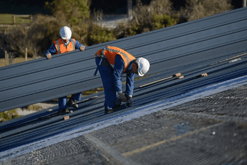 Builders On Roof